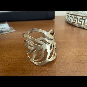 Beautiful stainless steel cuff bracelet. No damages.  Minimal wear